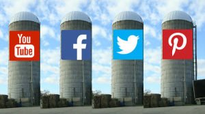 Four silos representing the social media networks Facebook, Twitter, Youtube and Pinterest